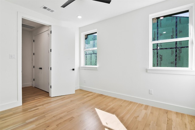 spare room with ceiling fan and light hardwood / wood-style flooring