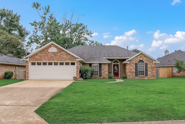 ranch-style home featuring a front lawn and a garage