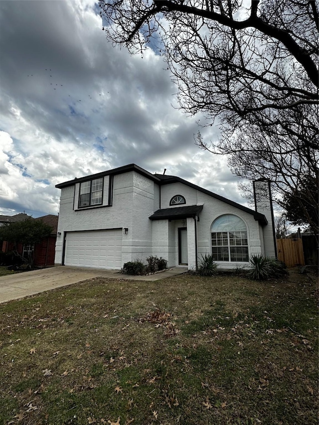 view of front facade with a front yard and a garage