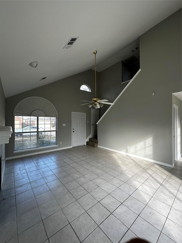 unfurnished living room featuring ceiling fan, light tile patterned flooring, and high vaulted ceiling