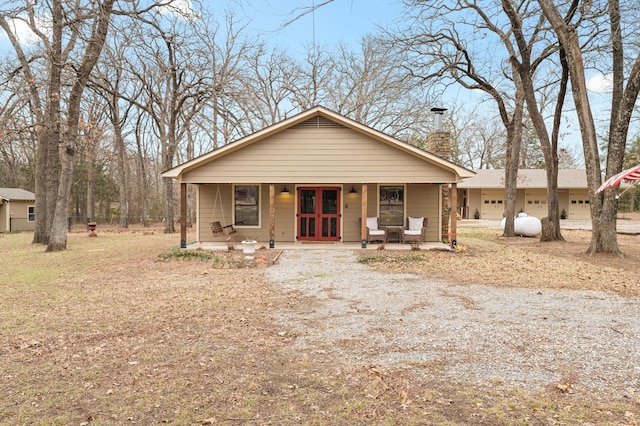 view of front of house featuring french doors and a porch