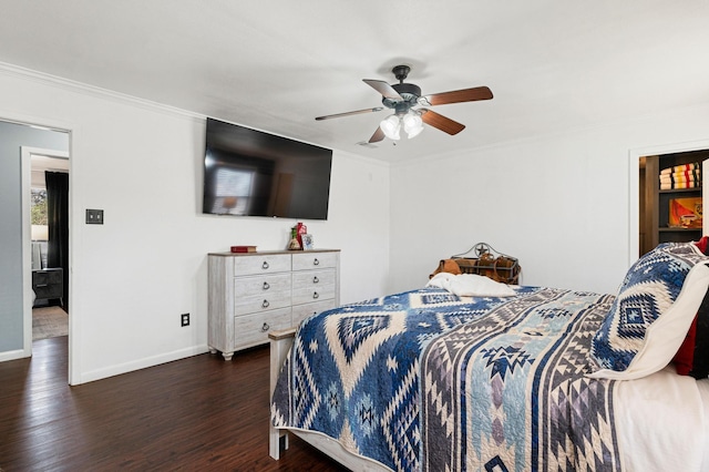 bedroom featuring ceiling fan, dark hardwood / wood-style floors, and crown molding