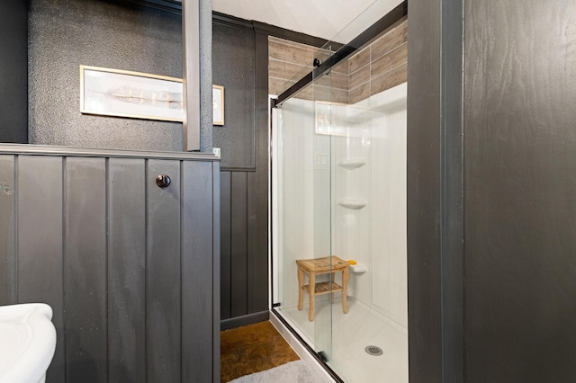 bathroom with a shower with shower door