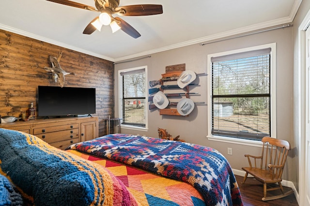 bedroom with ceiling fan, hardwood / wood-style flooring, and ornamental molding