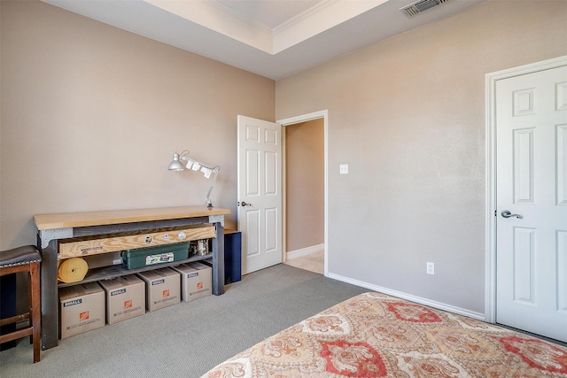 bedroom with carpet floors and crown molding