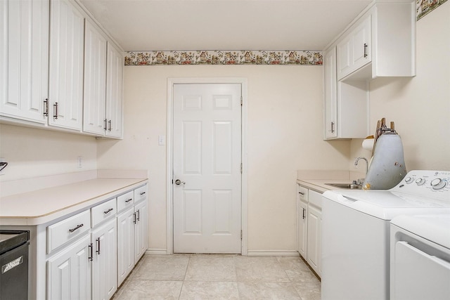 laundry room featuring cabinets, light tile patterned floors, washer and clothes dryer, and sink