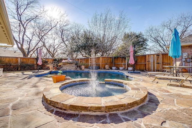 view of swimming pool featuring an in ground hot tub, a patio area, and pool water feature