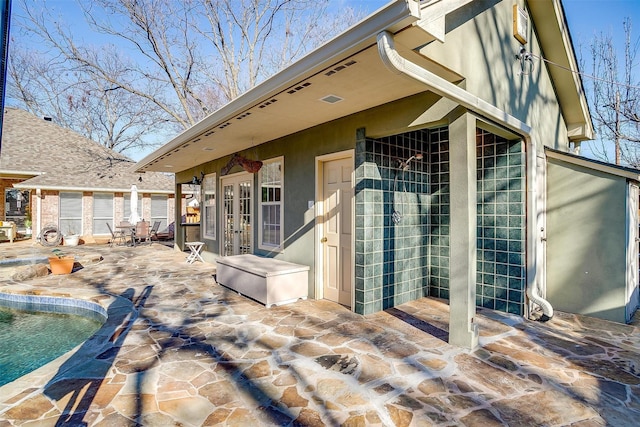 exterior space featuring a patio area and french doors