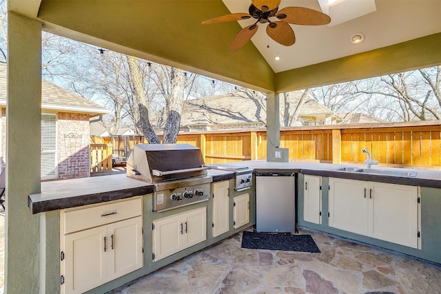 view of patio with ceiling fan, sink, grilling area, and area for grilling