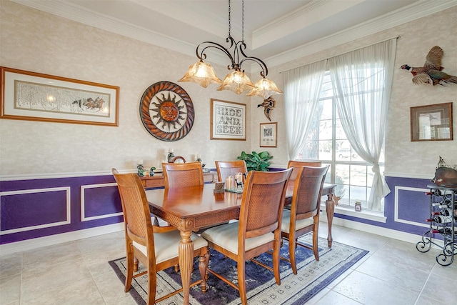 tiled dining space with a chandelier and ornamental molding