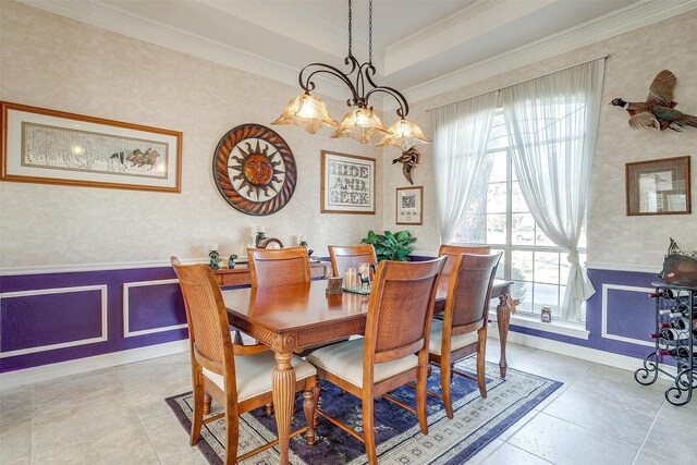 tiled living room with ceiling fan, ornamental molding, and a fireplace