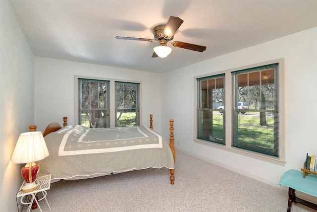 bedroom with ceiling fan and carpet flooring