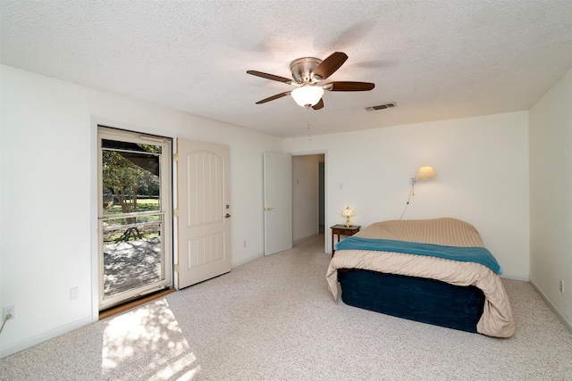 bedroom featuring a textured ceiling and ceiling fan