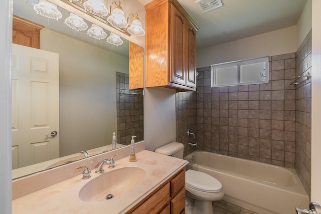 full bathroom with toilet, tiled shower / bath combo, and vanity