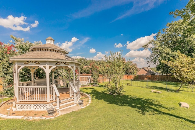 view of yard featuring a deck and a gazebo