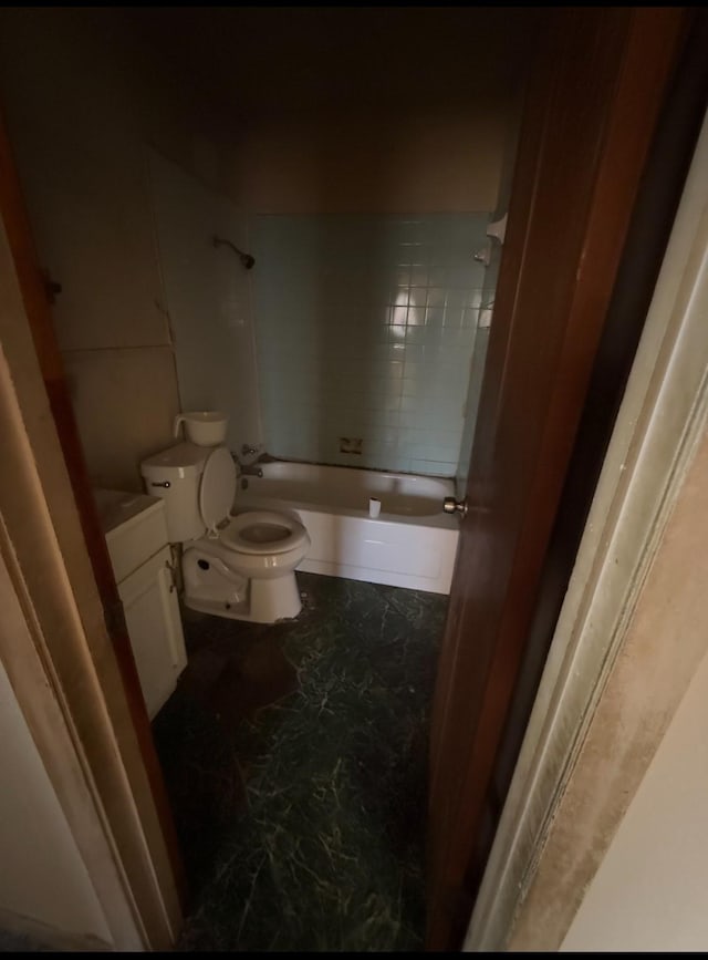 full bathroom featuring vanity, toilet, and tiled shower / bath