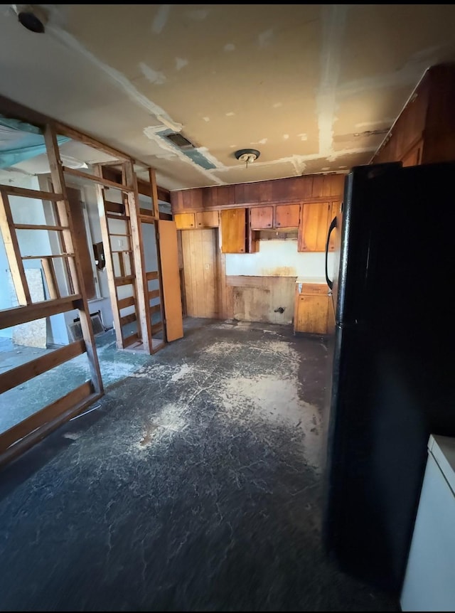 kitchen featuring black refrigerator