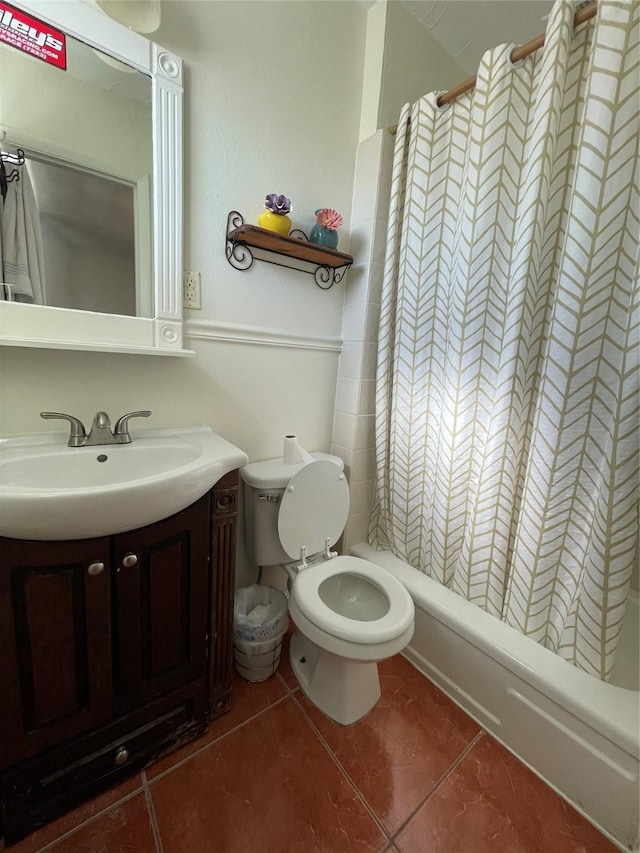 bathroom featuring toilet, vanity, and tile patterned floors