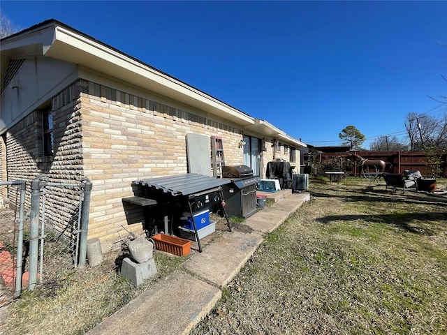 view of side of property with a yard