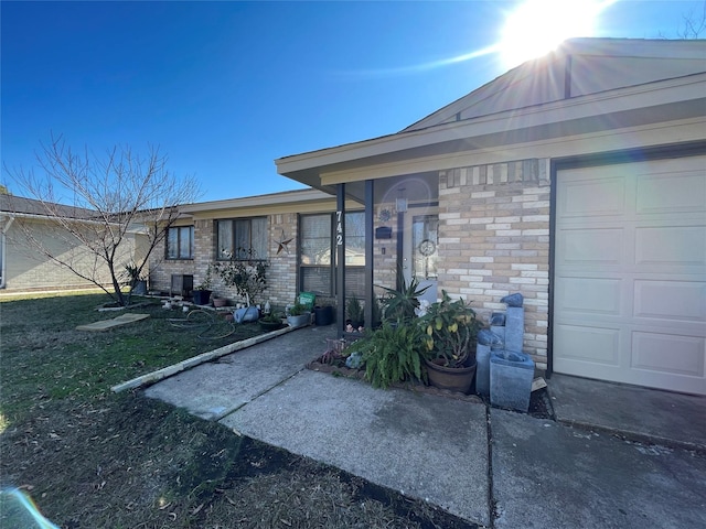 view of exterior entry with a garage