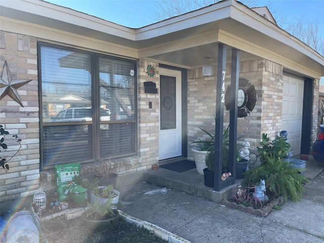 view of exterior entry featuring a garage