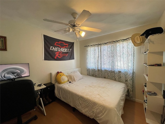 bedroom featuring ceiling fan and hardwood / wood-style flooring