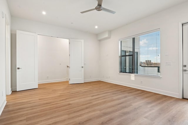 unfurnished bedroom featuring ceiling fan and light hardwood / wood-style flooring