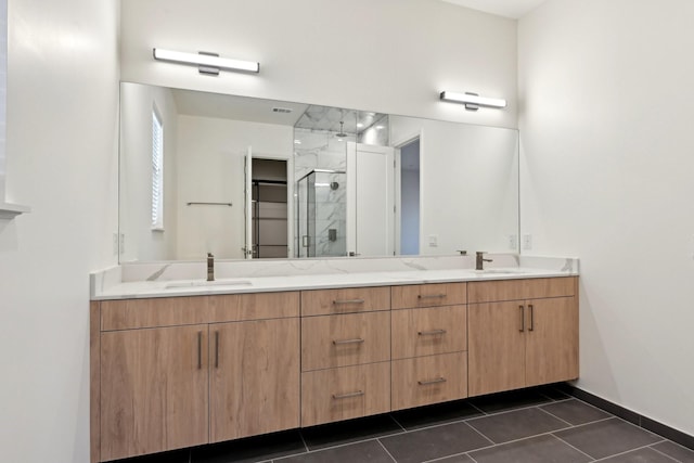 bathroom featuring vanity, tile patterned flooring, and a shower with door