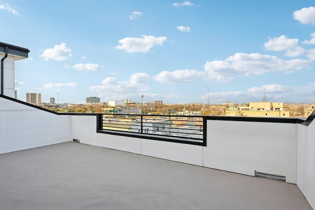 view of patio featuring a balcony