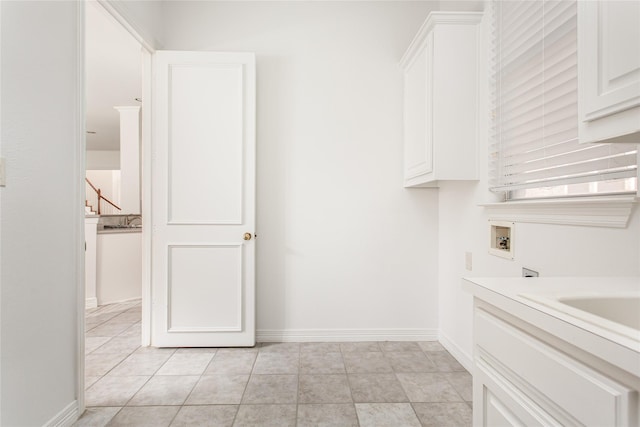 bathroom with tile patterned floors