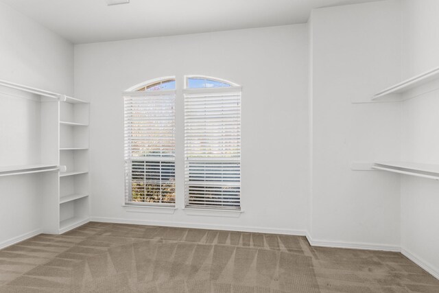 empty room featuring ceiling fan, crown molding, and dark hardwood / wood-style floors