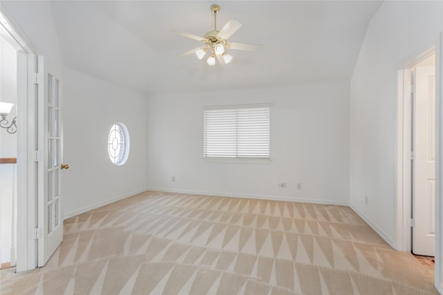 unfurnished room with light carpet, ceiling fan, and lofted ceiling