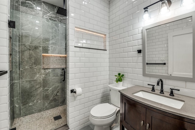 bathroom with toilet, a shower with shower door, tasteful backsplash, tile walls, and vanity