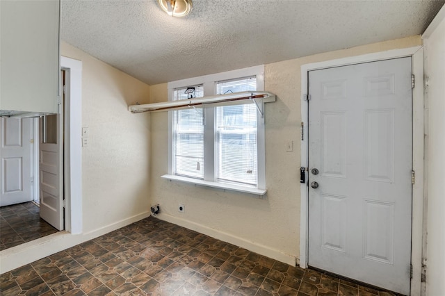 entrance foyer with a textured ceiling