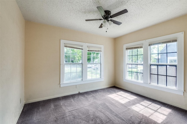 spare room with a textured ceiling, ceiling fan, and light colored carpet