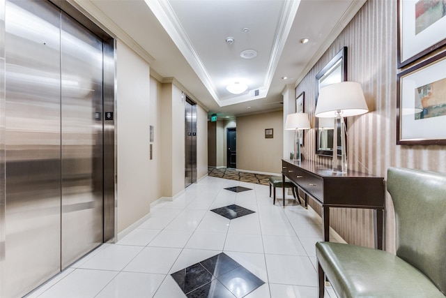 hall with light tile patterned flooring, a tray ceiling, elevator, and ornamental molding