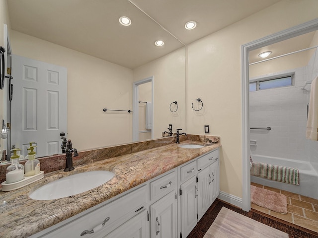 bathroom featuring bathtub / shower combination and vanity