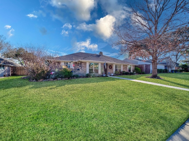 single story home with a front lawn