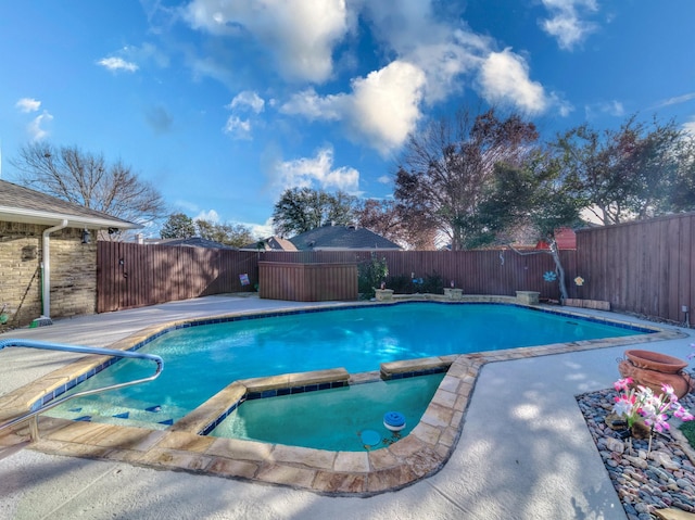 view of pool featuring an in ground hot tub and a patio