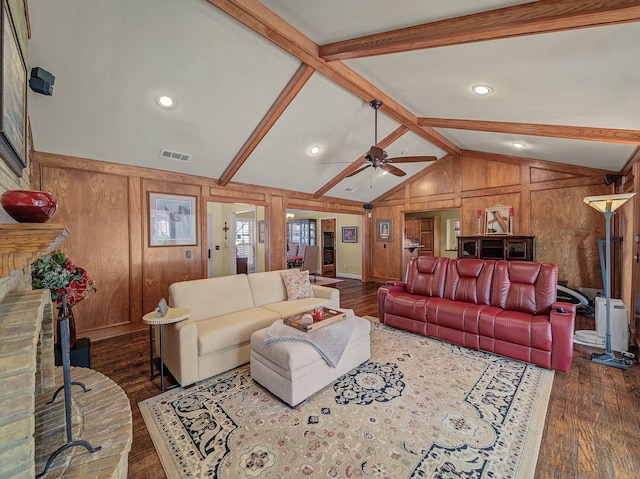 living room featuring ceiling fan, dark hardwood / wood-style floors, and lofted ceiling with beams