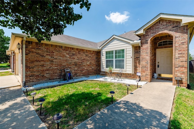 3729 Cook Ct, Fort Worth, TX 76244 - view of front of property featuring brick siding, a front lawn, roof with shingles, and a patio