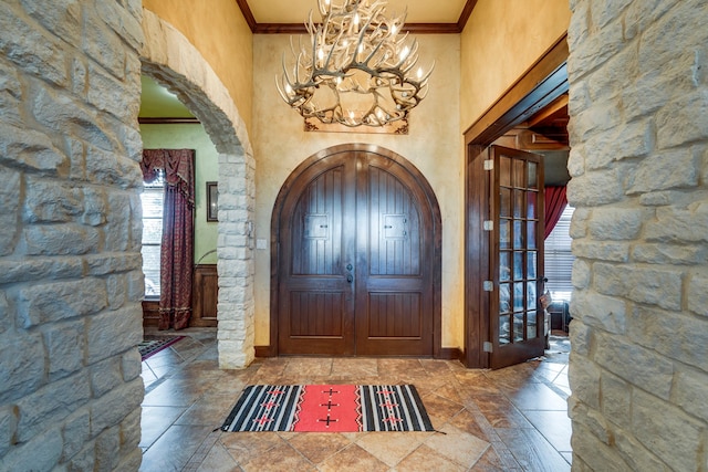 entrance foyer featuring crown molding