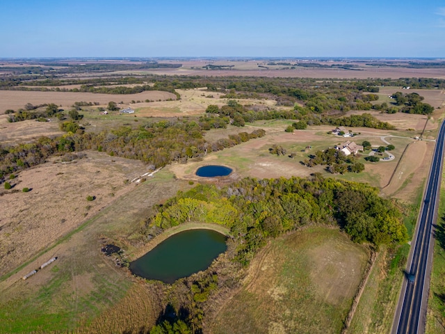 aerial view with a rural view and a water view