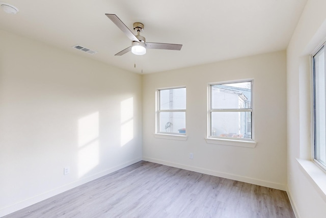 unfurnished room featuring ceiling fan and light hardwood / wood-style flooring