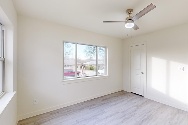 unfurnished room featuring ceiling fan and light hardwood / wood-style flooring