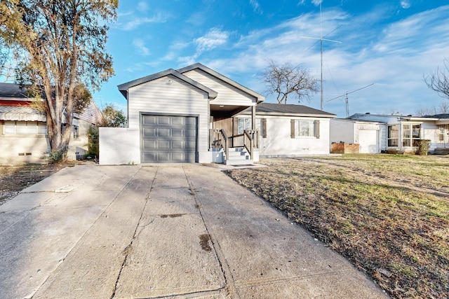 ranch-style home featuring a front lawn and a garage