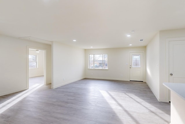 spare room with light wood-type flooring