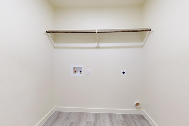 laundry room featuring washer hookup, light hardwood / wood-style floors, and electric dryer hookup