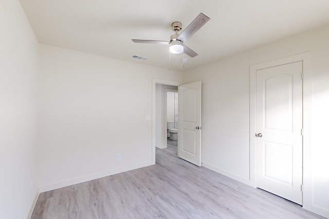 unfurnished bedroom with ceiling fan and light wood-type flooring