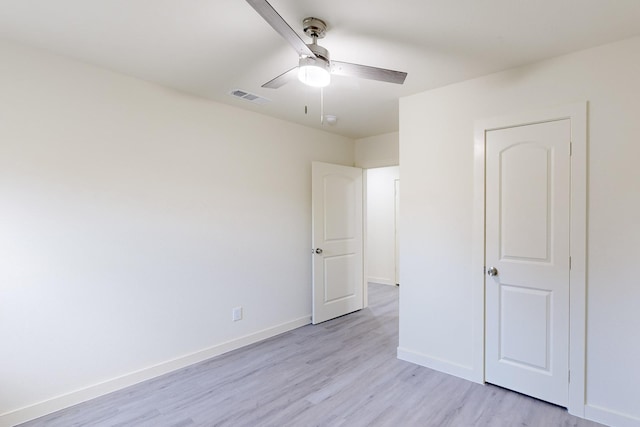 unfurnished bedroom with ceiling fan and light hardwood / wood-style flooring